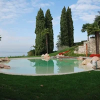Stone decorated pool surrounded by grass