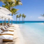 Beach chairs line large commercial sand pool