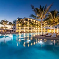 large commercial sand pool at resort at night