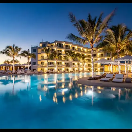large commercial sand pool at resort at night
